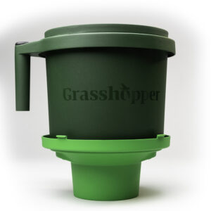 Grasshopper handheld harvesting and packing tool on top of removable lid.
