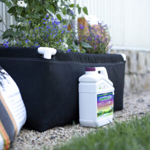 Lifestyle image of Ecoworks EC next to a fabric raised bed planter