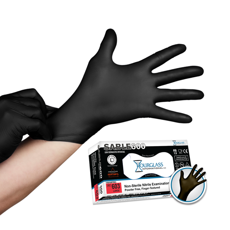 A person putting on black nitrile gloves . Small image of box of gloves in background.