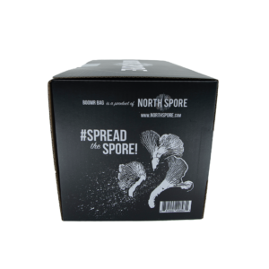 Side of packaging for North Spore Boomr Bag Manure Substrate - with the hashtag "spread the spore" and an etched image of a chanterelle mushroom.