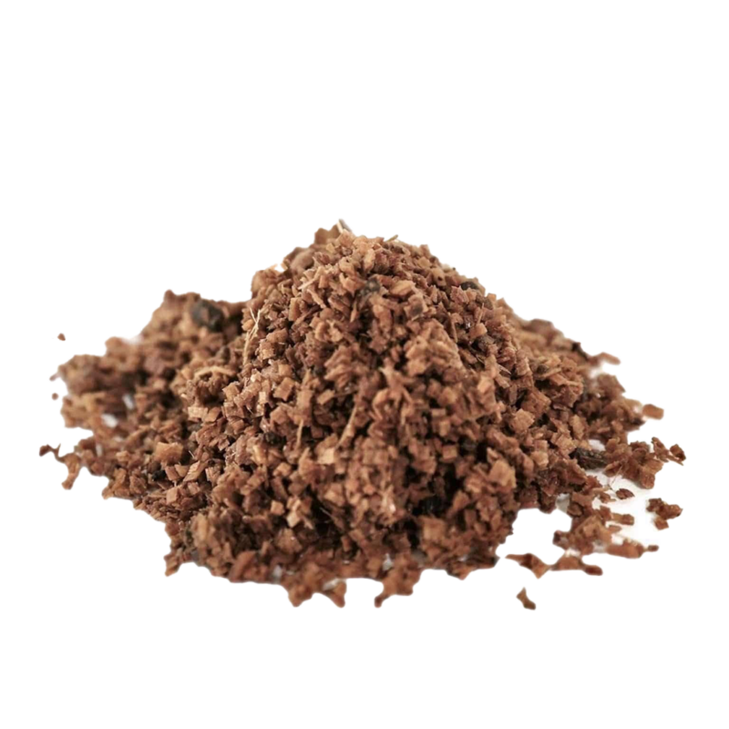 A small pile of brown square shaped shavings that make up the WOODLOVR hardwood substrate for mushrooms from North Spore