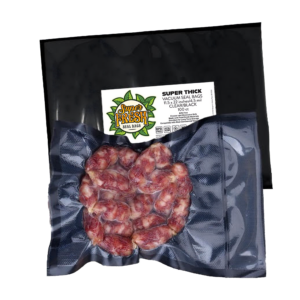 A transparent vacuum-sealed bag from SuperFresh Vacuum Seal Bags containing a red meat product, possibly sausages or meat rolls. The black and clear bag, measuring 11.5x22 inches, displays the product clearly through the plastic. The label on the bag includes the brand logo with green leaves, product information, and certification logos indicating BPA free and recyclable material.