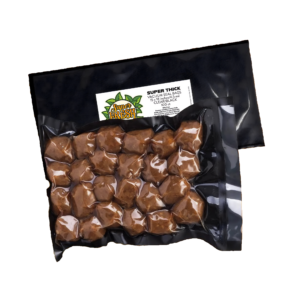 A vacuum-sealed SuperFresh Seal Bag containing meatballs, highlighted against the clear and black background of the bag. The bag's dimensions are 15x18 inches and it features a white label with the SuperFresh logo, product details, and a QR code at the top left corner