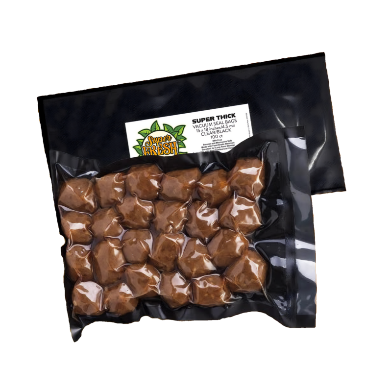 A vacuum-sealed SuperFresh Seal Bag containing meatballs, highlighted against the clear and black background of the bag. The bag's dimensions are 15x18 inches and it features a white label with the SuperFresh logo, product details, and a QR code at the top left corner