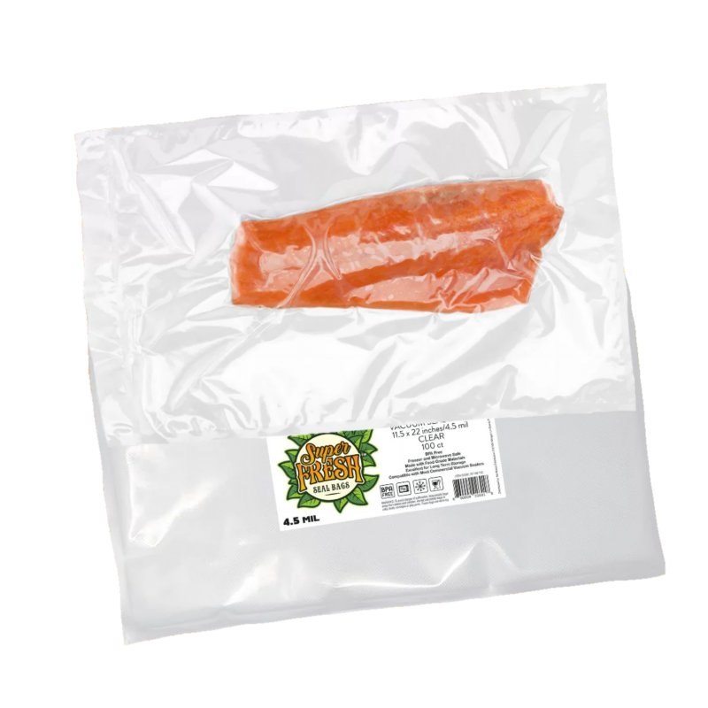 A single piece of salmon, with a rich orange color, vacuum-sealed in a clear SuperFresh Seal Bag. The bag, super thick and measuring 11.5x22 inches, is transparent, showcasing the freshness and quality of the fish inside. A label in the corner includes the green SuperFresh logo, product specifications, and a QR code.